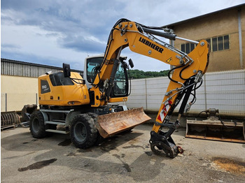 Escavadeira de rodas LIEBHERR A 910
