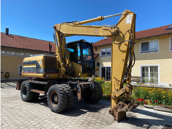 Escavadeira de rodas CATERPILLAR M312