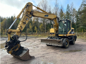 Escavadeira de rodas CATERPILLAR M312