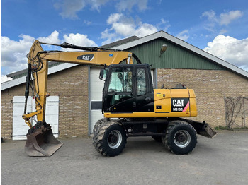 Escavadeira de rodas CATERPILLAR M313D