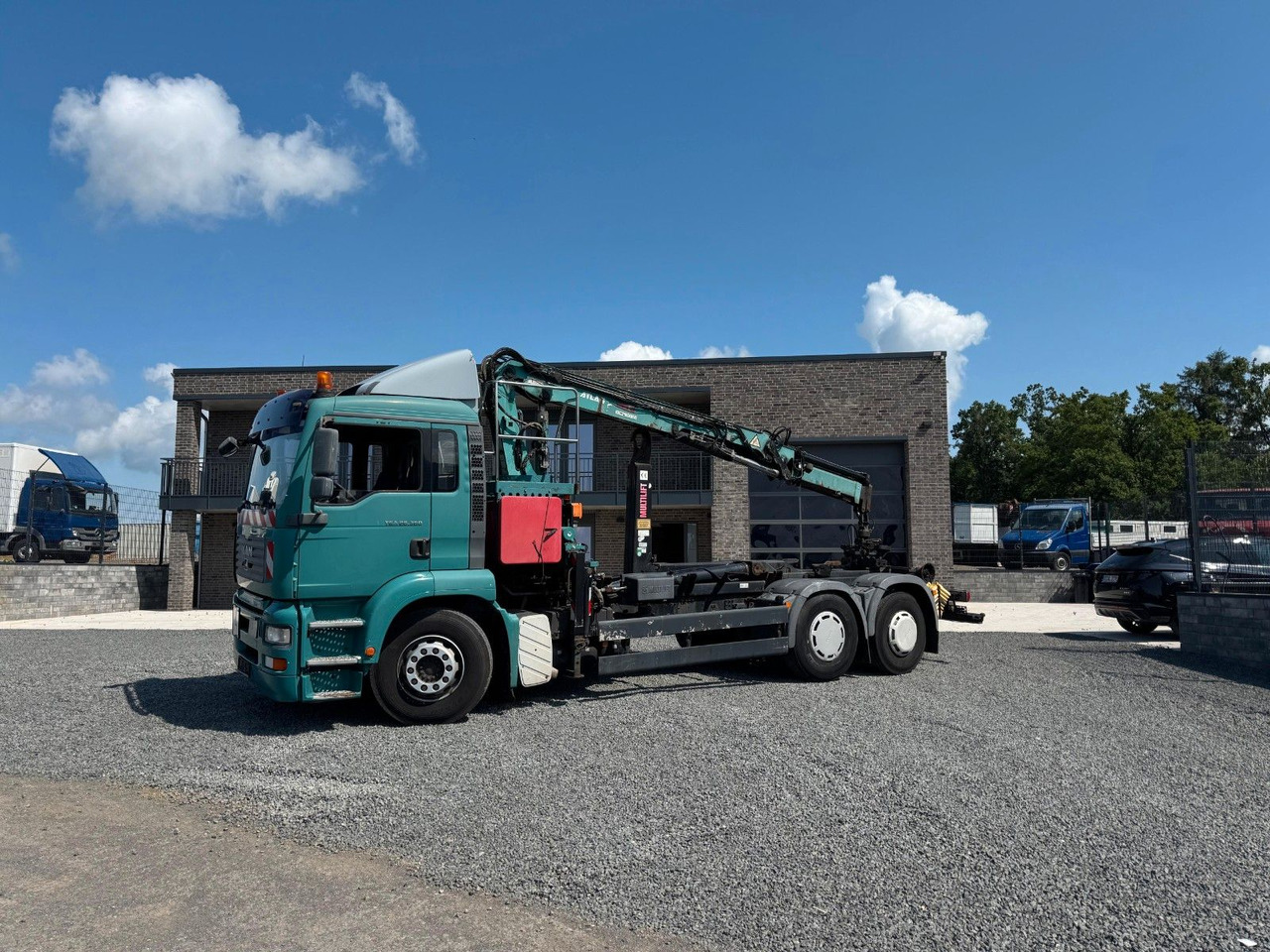 Camião polibenne, Camião grua MAN TGA 26.360 Kran TeRex Multilift Fernbedienung: foto 1