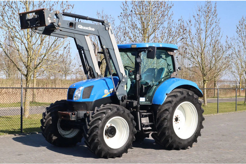 New Holland T6040 | FRONT LOADER | 50KM/H | QUICK COUPLER - Trator: foto 1 New Holland T6040 | FRONT LOADER | 50KM/H | QUICK COUPLER - Trator: foto 1