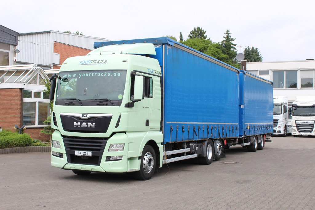MAN TGX 26.460 Retarder Jumbo-Zug 120M3 Durchlade - Camião de lona: foto 1 MAN TGX 26.460 Retarder Jumbo-Zug 120M3 Durchlade - Camião de lona: foto 1