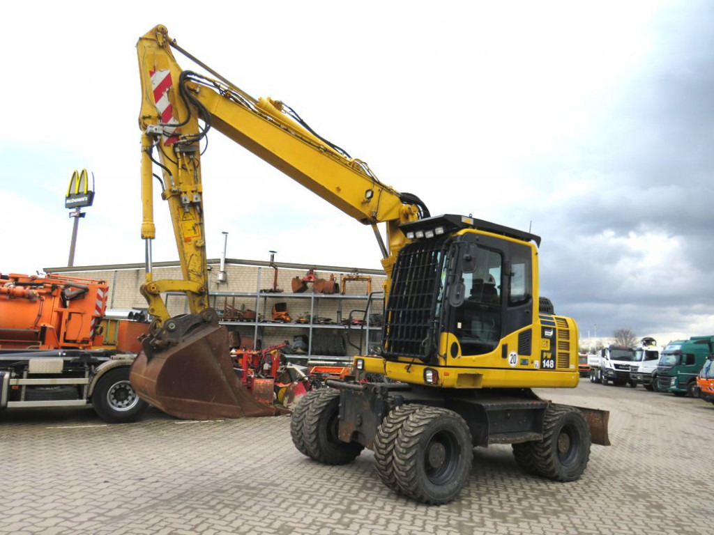 KOMATSU HANOMAG Mobilbagger PW 148 - 8 Bagger 6.824h Deutsch top - Escavadeira de rodas: foto 1 KOMATSU HANOMAG Mobilbagger PW 148 - 8 Bagger 6.824h Deutsch top - Escavadeira de rodas: foto 1