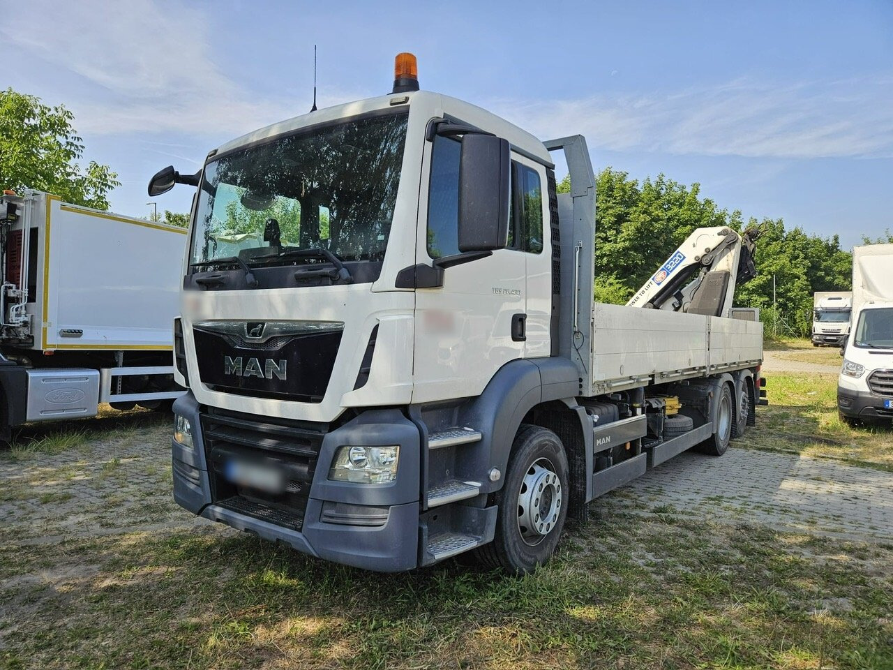 MAN TGS 26.430 6x2-4 BL TGS 26.430 6x2-4 BL, Lenk-/Liftachse, Heckkran HMF 3220K3, Funk - Camião grua, Camião de caixa aberta/ Plataforma: foto 1 MAN TGS 26.430 6x2-4 BL TGS 26.430 6x2-4 BL, Lenk-/Liftachse, Heckkran HMF 3220K3, Funk - Camião grua, Camião de caixa aberta/ Plataforma: foto 1