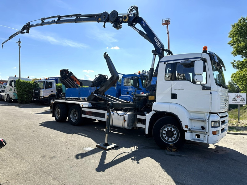 MAN TGA 26.310 6X2 HOOKLIFT + CRANE COPMA 160.4 + JIB J2 + WINCH - RADIO - LIFT + STEERING AXLE - EURO 3 - BE - Camião polibenne, Camião grua: foto 1 MAN TGA 26.310 6X2 HOOKLIFT + CRANE COPMA 160.4 + JIB J2 + WINCH - RADIO - LIFT + STEERING AXLE - EURO 3 - BE - Camião polibenne, Camião grua: foto 1