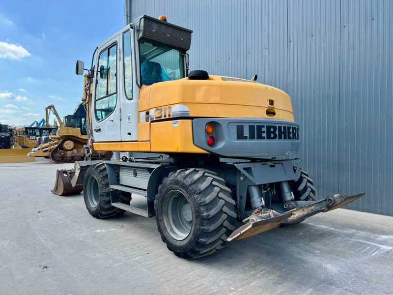Liebherr A311 Litronic - Escavadeira de rodas: foto 2 Liebherr A311 Litronic - Escavadeira de rodas: foto 2