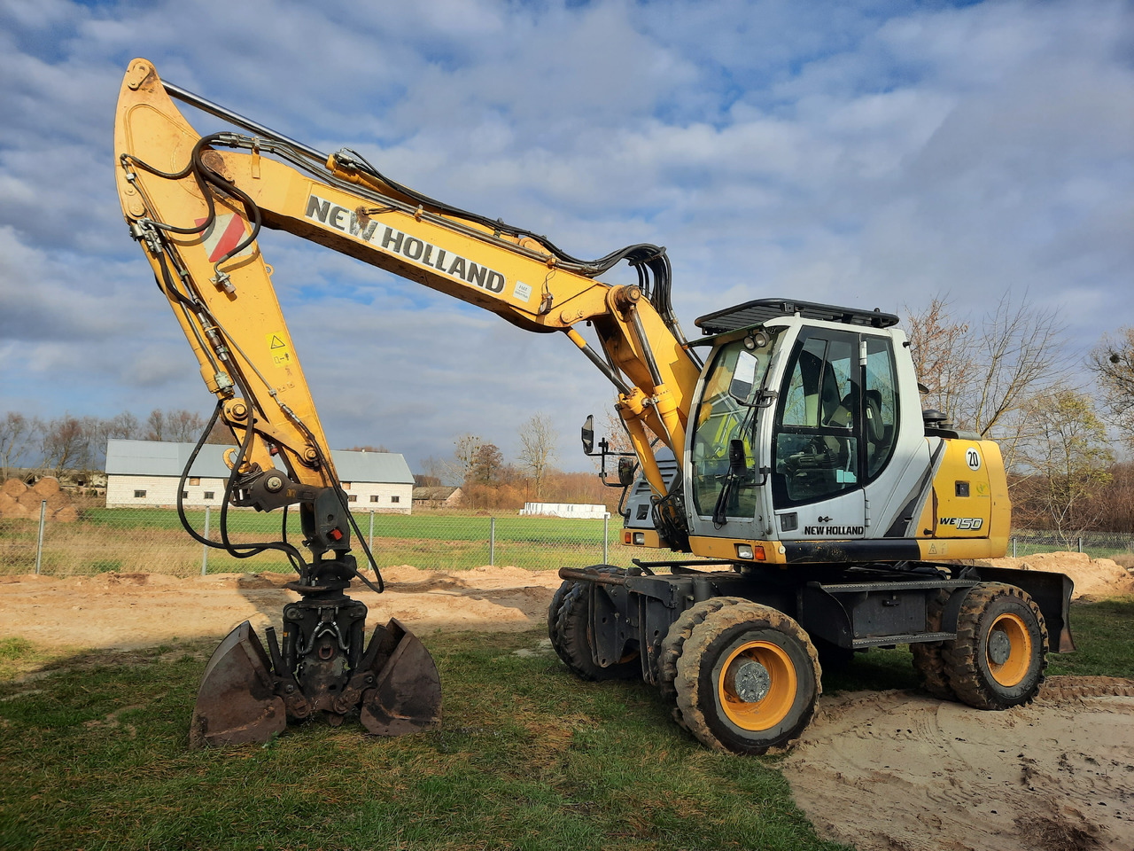 NEW HOLLAND WE150C - Escavadeira de rodas: foto 1 NEW HOLLAND WE150C - Escavadeira de rodas: foto 1