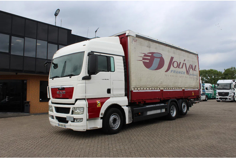 MAN TGX 26.440 * EURO5 * 6X2 * LIFT AXLE * - Camião de lona: foto 2 MAN TGX 26.440 * EURO5 * 6X2 * LIFT AXLE * - Camião de lona: foto 2