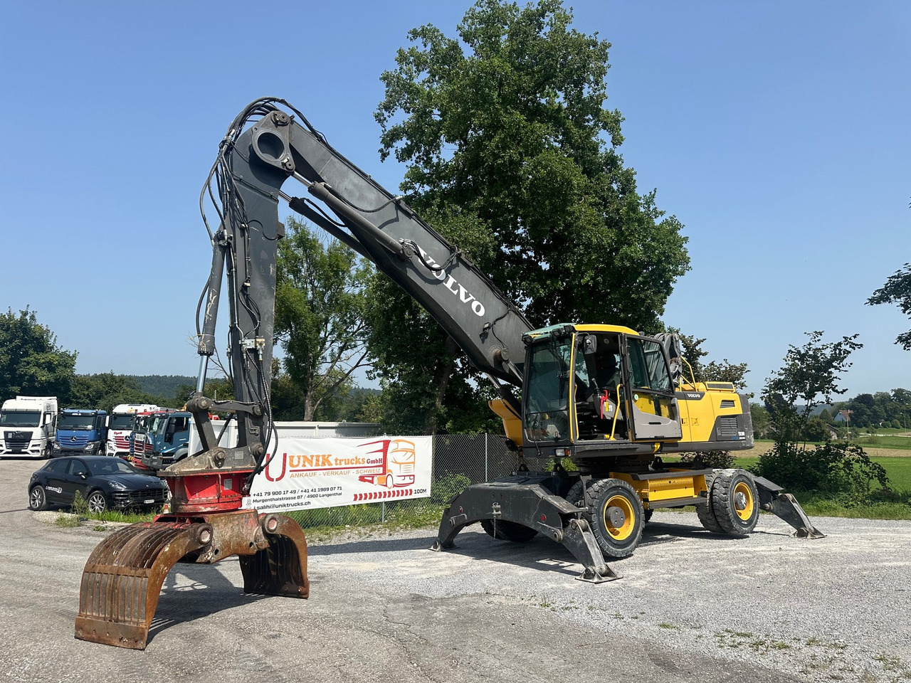 VOLVO EW 210 D 24t Greifer - Escavadeira: foto 1 VOLVO EW 210 D 24t Greifer - Escavadeira: foto 1