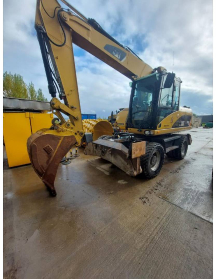 CAT M315D - Escavadeira de rodas: foto 1 CAT M315D - Escavadeira de rodas: foto 1