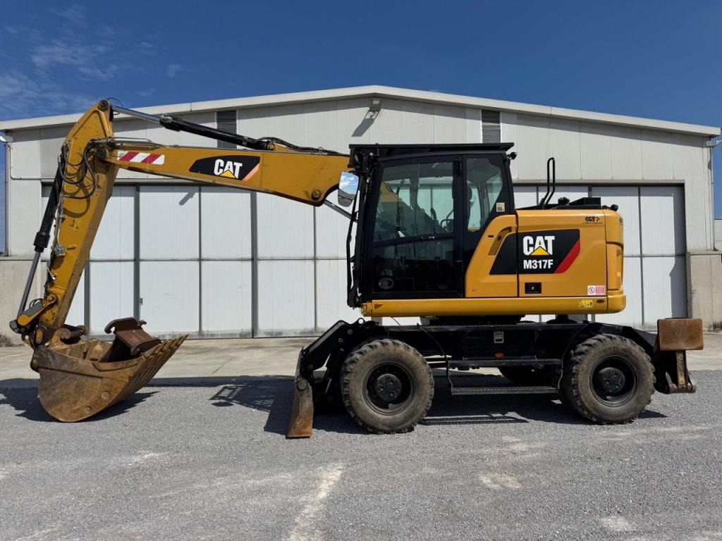 Caterpillar M317F - Escavadeira de rodas: foto 1 Caterpillar M317F - Escavadeira de rodas: foto 1