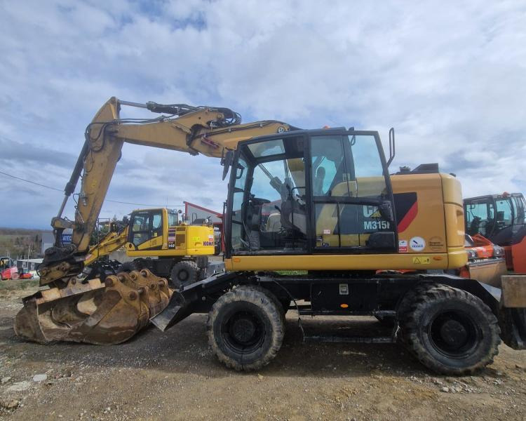 Caterpillar M315F F - Escavadeira de rodas: foto 1 Caterpillar M315F F - Escavadeira de rodas: foto 1