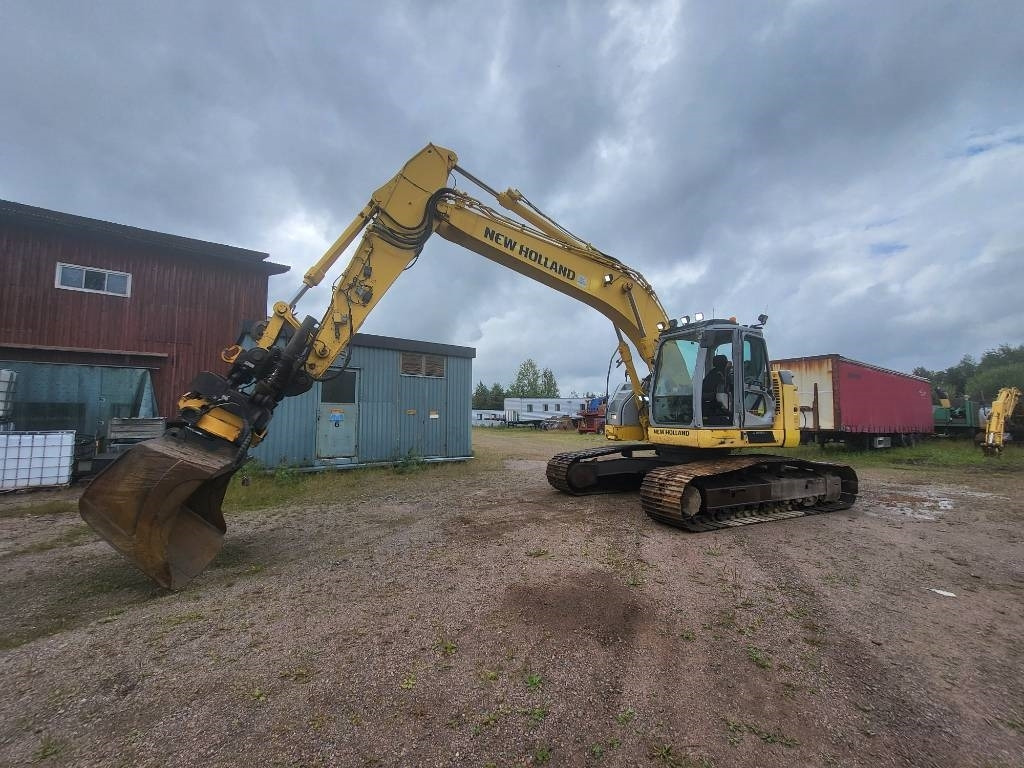 New Holland Kobelco E 235 B SR-2 - Escavadora de rastos: foto 1 New Holland Kobelco E 235 B SR-2 - Escavadora de rastos: foto 1