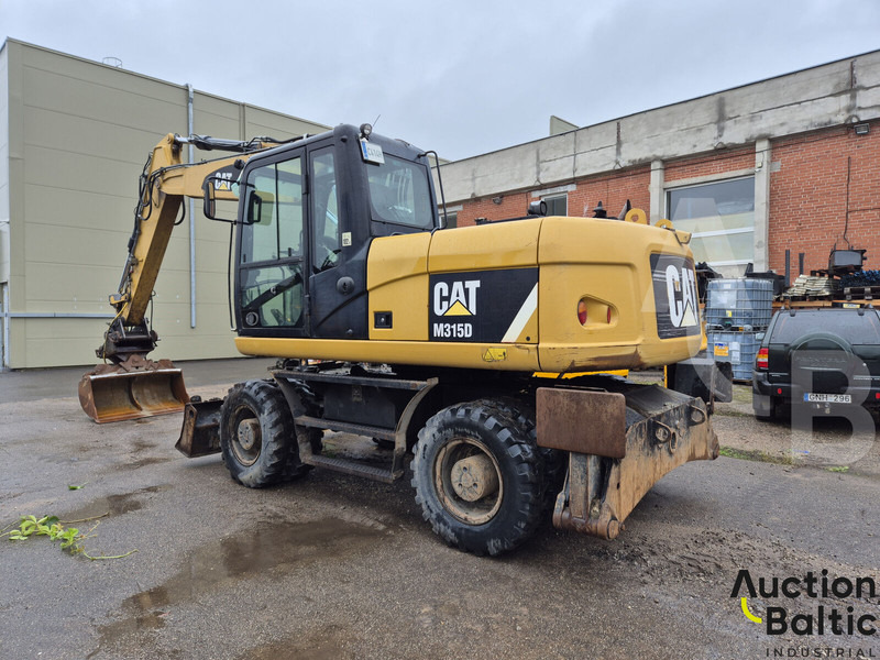 Caterpillar M 315 D - Escavadeira de rodas: foto 4 Caterpillar M 315 D - Escavadeira de rodas: foto 4