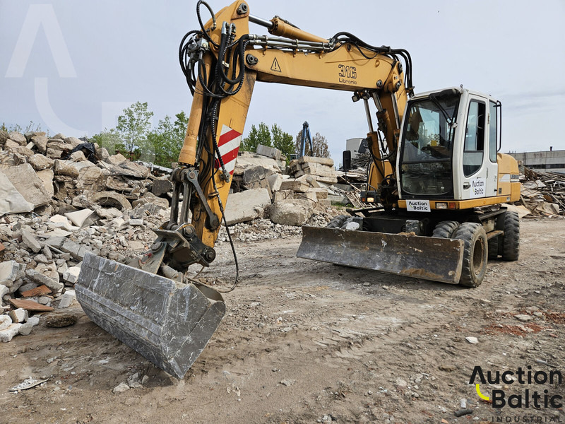 Liebherr A 316 Litronic - Escavadeira de rodas: foto 1 Liebherr A 316 Litronic - Escavadeira de rodas: foto 1