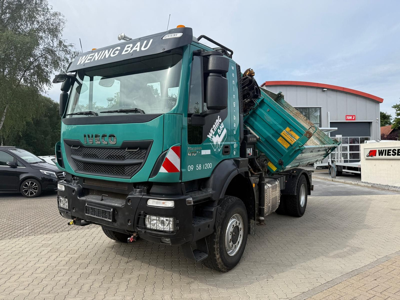 Iveco AD190 T/W Trakker 410 4x4 Allrad Kran KipperHIAB - Camião basculante, Camião grua: foto 1 Iveco AD190 T/W Trakker 410 4x4 Allrad Kran KipperHIAB - Camião basculante, Camião grua: foto 1