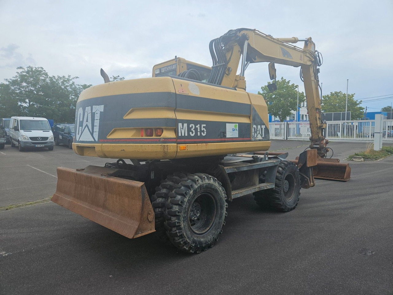 CAT M315 Mobilbagger mit Pratzen und Schild - Escavadeira de rodas: foto 3 CAT M315 Mobilbagger mit Pratzen und Schild - Escavadeira de rodas: foto 3