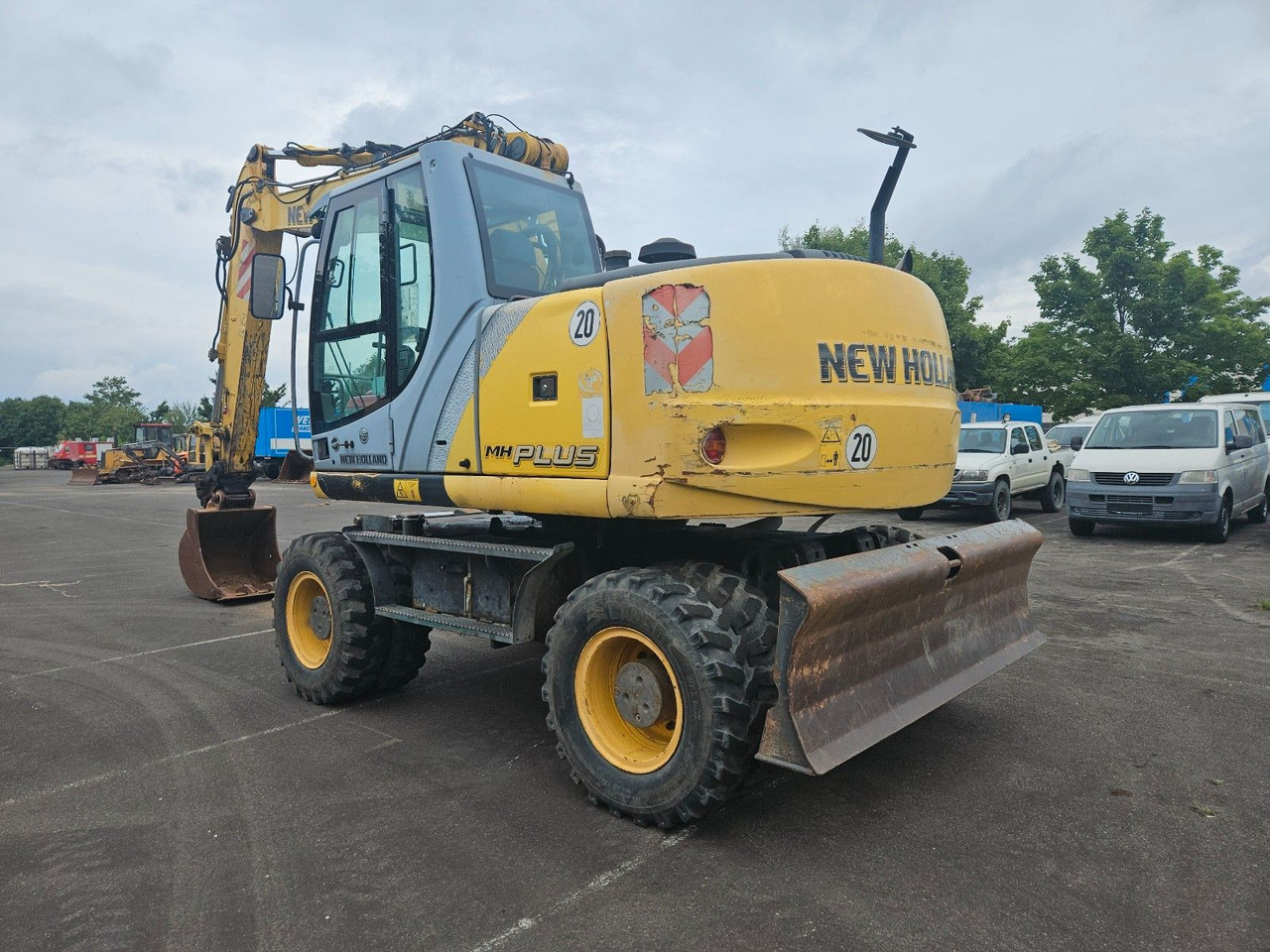 New Holland MH Plus 18t Mobilbagger - Escavadeira de rodas: foto 2 New Holland MH Plus 18t Mobilbagger - Escavadeira de rodas: foto 2