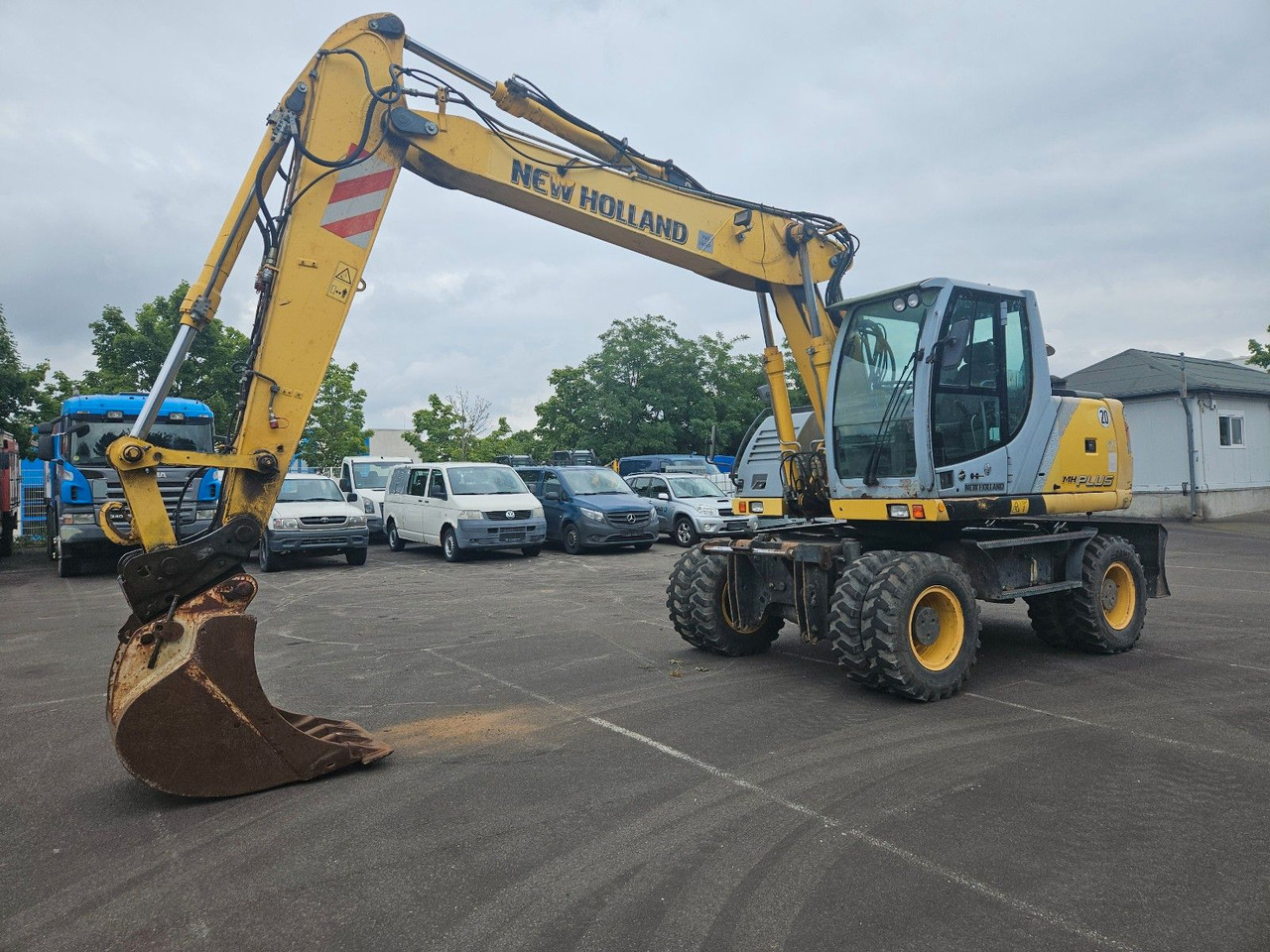 New Holland MH Plus 18t Mobilbagger - Escavadeira de rodas: foto 1 New Holland MH Plus 18t Mobilbagger - Escavadeira de rodas: foto 1