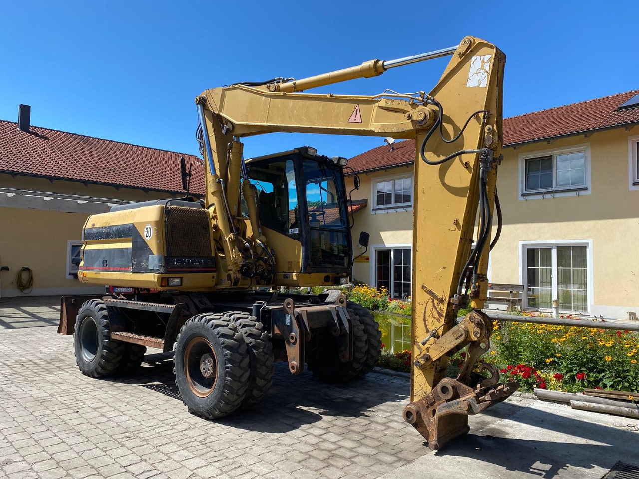 Caterpillar M 312 - Escavadeira de rodas: foto 1 Caterpillar M 312 - Escavadeira de rodas: foto 1