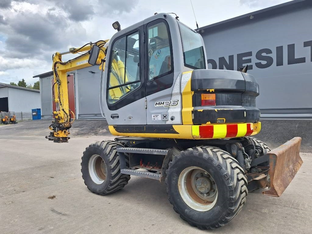 New Holland MYYTY! SOLD! MH2.6 ENGCON PIHDEILLÄ - Escavadeira de rodas: foto 2 New Holland MYYTY! SOLD! MH2.6 ENGCON PIHDEILLÄ - Escavadeira de rodas: foto 2