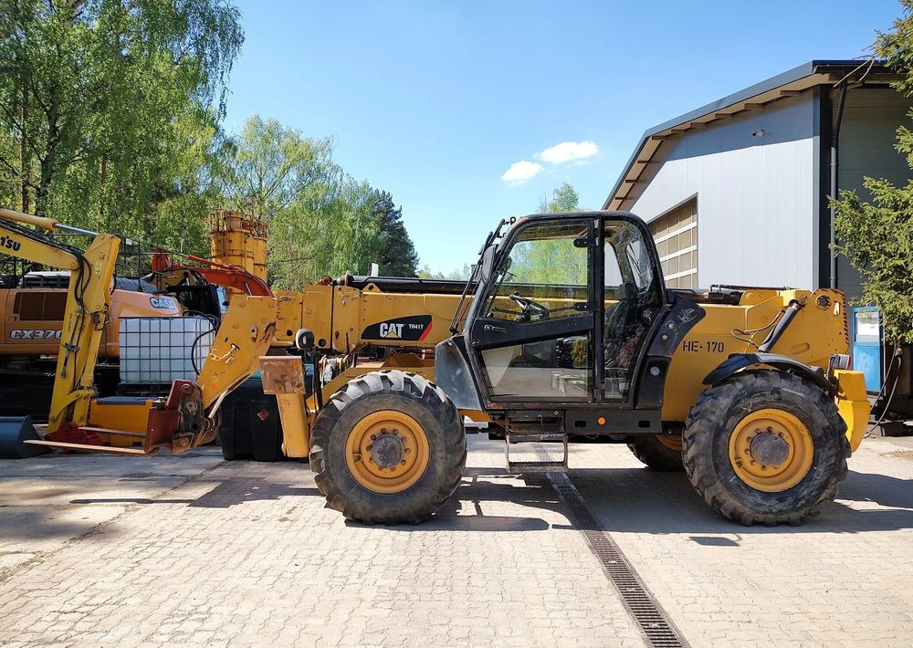 Caterpillar TH417 - Empilhador telescópico: foto 1 Caterpillar TH417 - Empilhador telescópico: foto 1