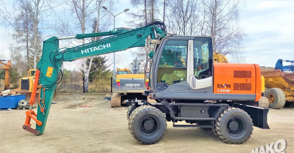 Hitachi ZX140W-3 - Escavadeira de rodas: foto 1 Hitachi ZX140W-3 - Escavadeira de rodas: foto 1