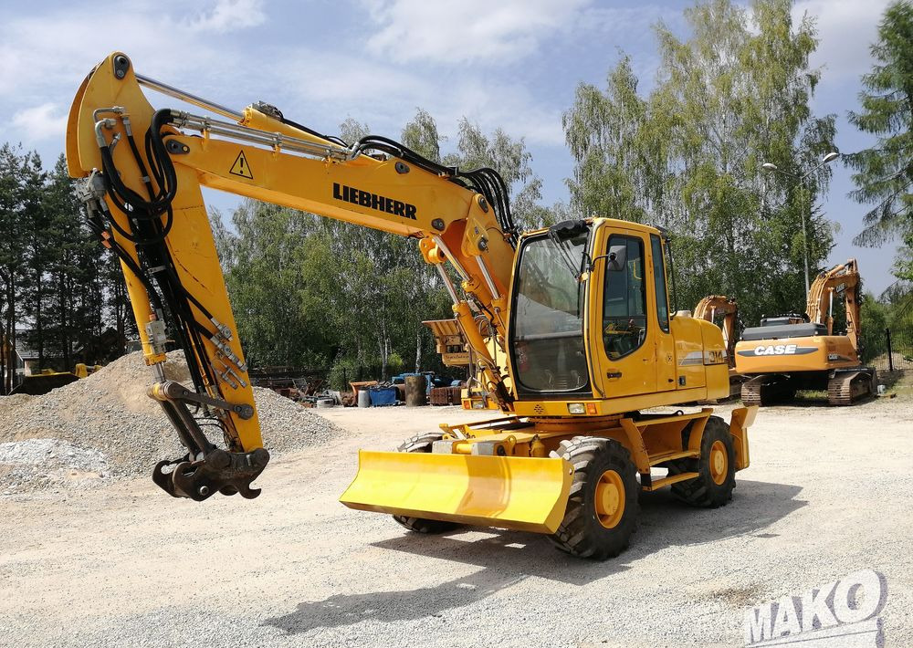 Liebherr A 314 Litronic - Escavadeira de rodas: foto 1 Liebherr A 314 Litronic - Escavadeira de rodas: foto 1