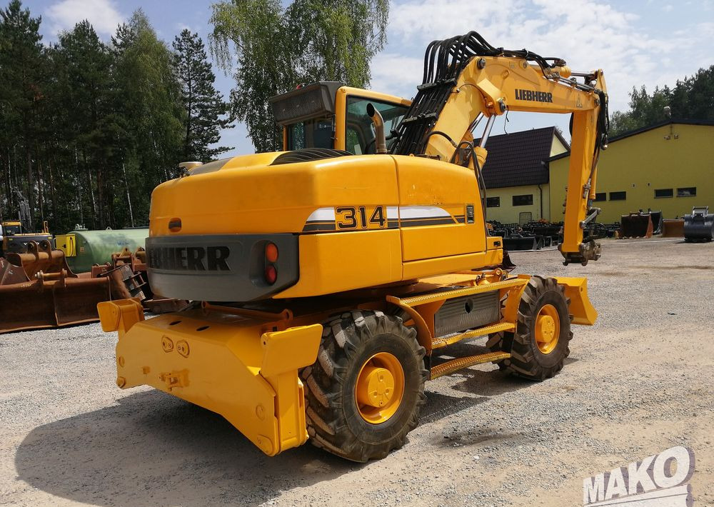 Liebherr A 314 Litronic - Escavadeira de rodas: foto 5 Liebherr A 314 Litronic - Escavadeira de rodas: foto 5