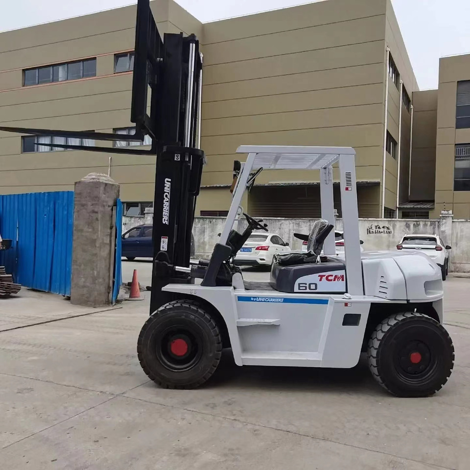 TCM 6 ton Diesel Forklift FD60 with Fork Positioner - Empilhador a diesel: foto 1 TCM 6 ton Diesel Forklift FD60 with Fork Positioner - Empilhador a diesel: foto 1
