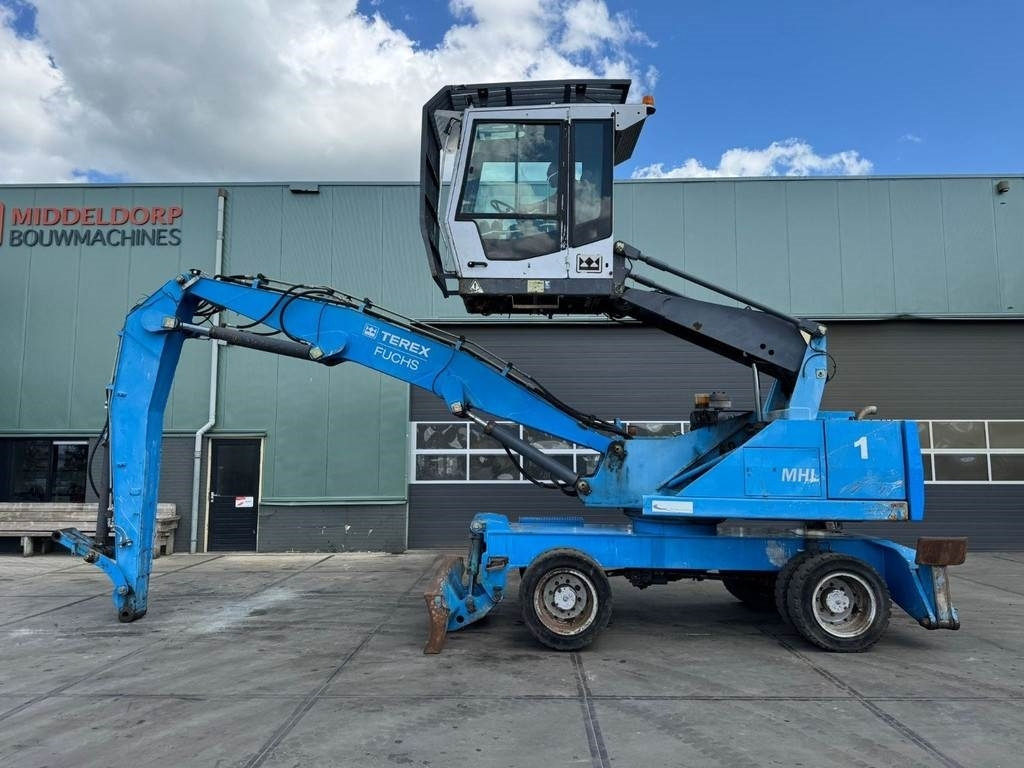 Fuchs MHL 320 - Manipulador de material: foto 1 Fuchs MHL 320 - Manipulador de material: foto 1