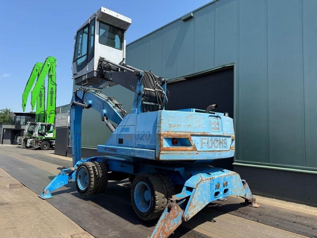 Fuchs MHL 320 - Manipulador de material: foto 3 Fuchs MHL 320 - Manipulador de material: foto 3