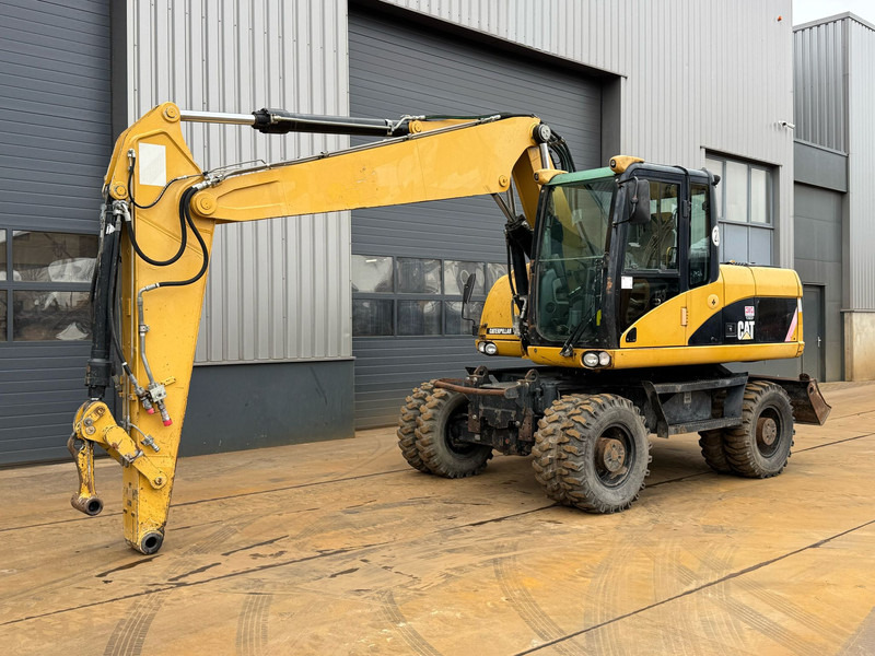 Caterpillar M315D - Escavadeira de rodas: foto 2 Caterpillar M315D - Escavadeira de rodas: foto 2