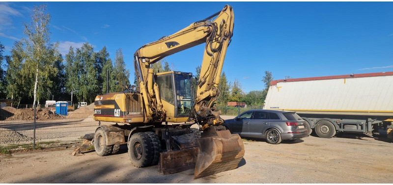 Caterpillar M 315 Rototilt - Escavadeira de rodas: foto 1 Caterpillar M 315 Rototilt - Escavadeira de rodas: foto 1