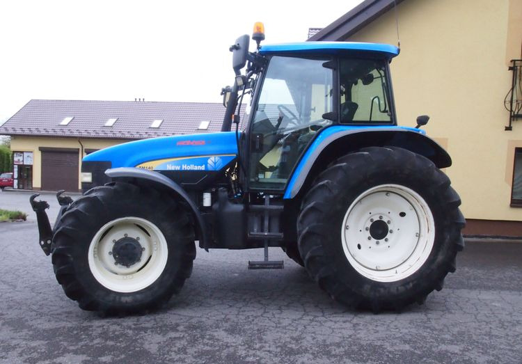 Ciągnik New Holland TM 140 2004 Przedni TUZ - Trator: foto 5 Ciągnik New Holland TM 140 2004 Przedni TUZ - Trator: foto 5