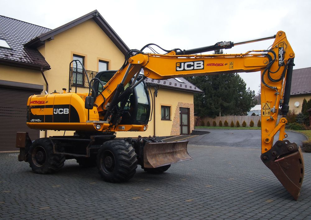 Koparka kołowa JCB JS145W 2011 Koparka JCB - Escavadeira de rodas: foto 1 Koparka kołowa JCB JS145W 2011 Koparka JCB - Escavadeira de rodas: foto 1