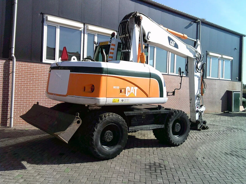Caterpillar M313D - Escavadeira de rodas: foto 4 Caterpillar M313D - Escavadeira de rodas: foto 4