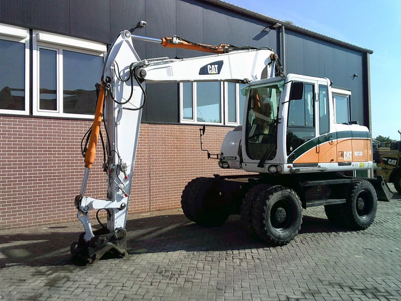 Caterpillar M313D - Escavadeira de rodas: foto 1 Caterpillar M313D - Escavadeira de rodas: foto 1