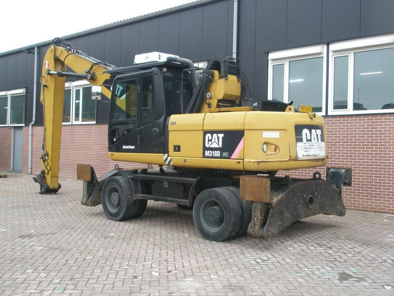 Caterpillar M318D - Escavadeira de rodas: foto 2 Caterpillar M318D - Escavadeira de rodas: foto 2