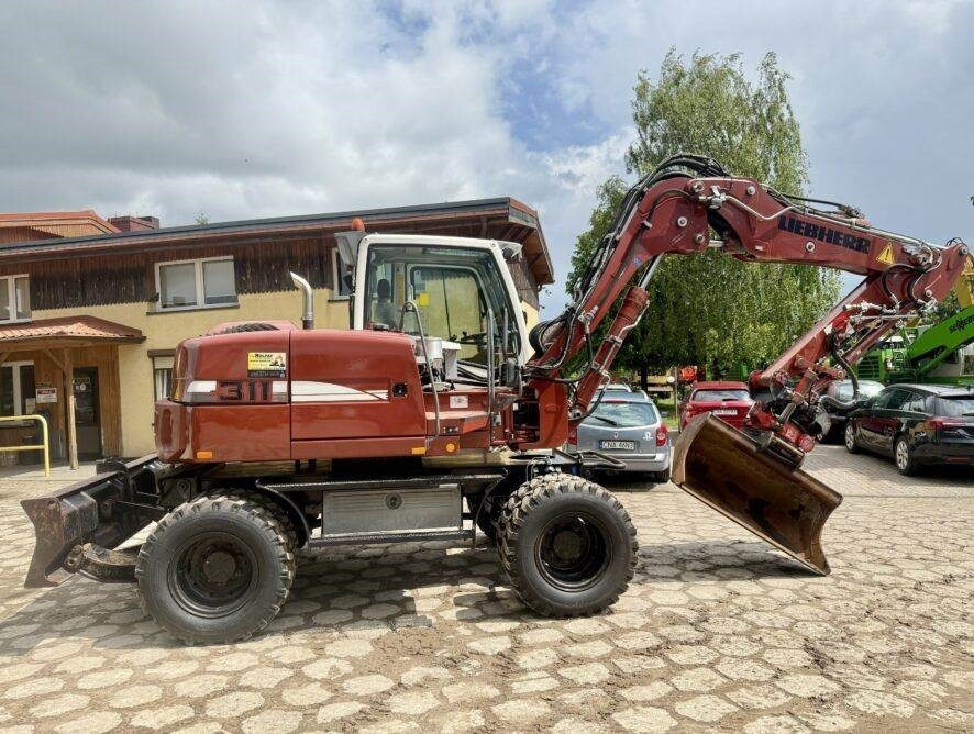 Liebherr A311 Litronic - Escavadeira de rodas: foto 1 Liebherr A311 Litronic - Escavadeira de rodas: foto 1