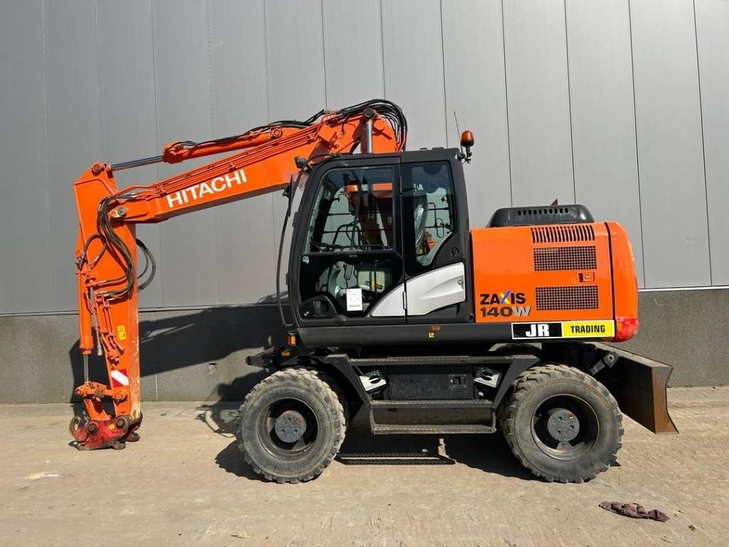 Hitachi ZX 140 W-5B - Escavadeira de rodas: foto 1 Hitachi ZX 140 W-5B - Escavadeira de rodas: foto 1