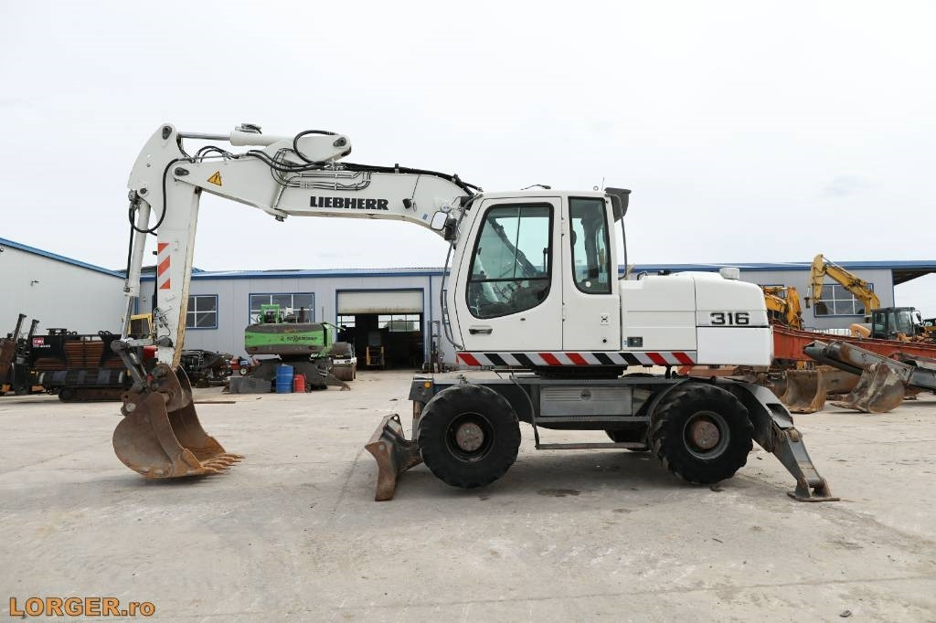 Liebherr A 316 Litronic - Escavadeira de rodas: foto 4 Liebherr A 316 Litronic - Escavadeira de rodas: foto 4