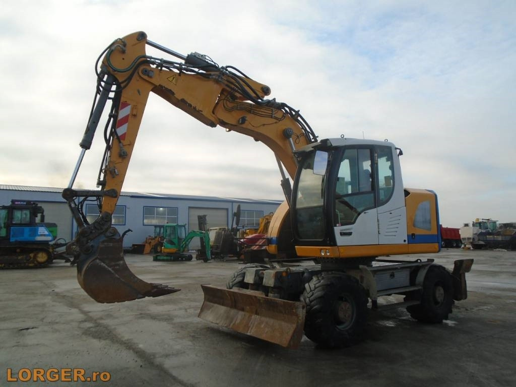 Liebherr A 914 Compact - Escavadeira de rodas: foto 1 Liebherr A 914 Compact - Escavadeira de rodas: foto 1