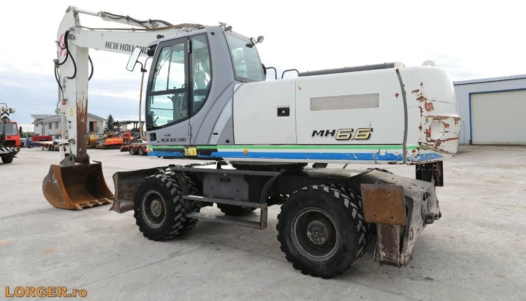 New Holland MH 6.6 + Sandvic Hammer - Escavadeira de rodas: foto 3 New Holland MH 6.6 + Sandvic Hammer - Escavadeira de rodas: foto 3