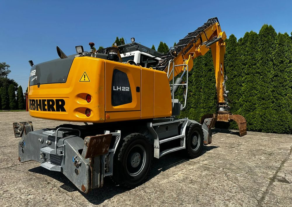 Liebherr LH22 M - Escavadeira de rodas: foto 1 Liebherr LH22 M - Escavadeira de rodas: foto 1