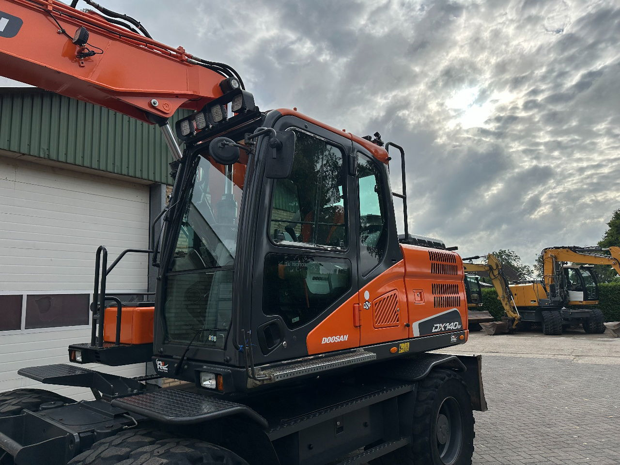 Doosan DX140W-5 - Escavadeira de rodas: foto 3 Doosan DX140W-5 - Escavadeira de rodas: foto 3