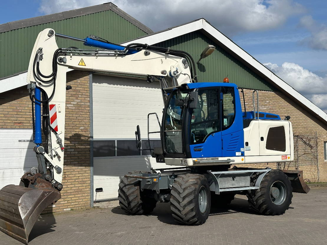 Liebherr A914 - Escavadeira de rodas: foto 1 Liebherr A914 - Escavadeira de rodas: foto 1