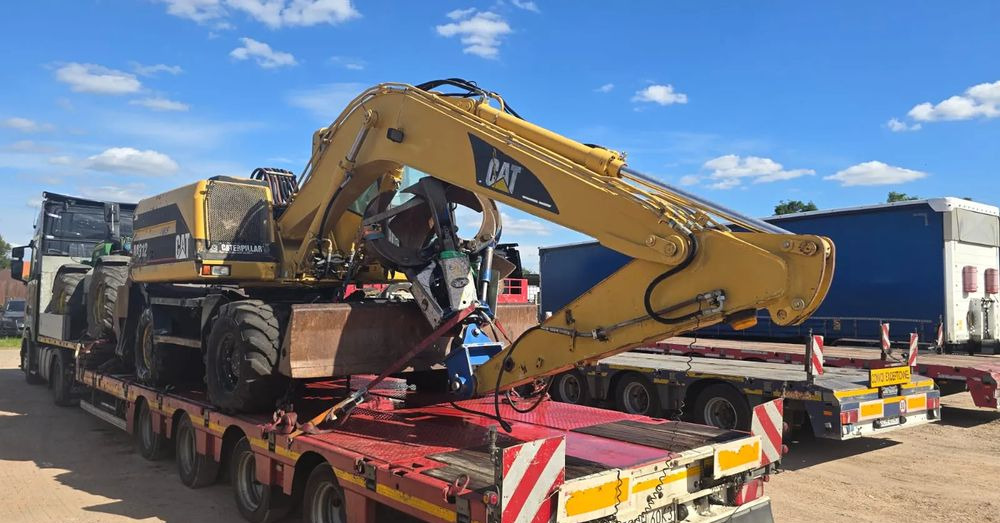 Caterpillar M312 - Escavadeira de rodas: foto 1 Caterpillar M312 - Escavadeira de rodas: foto 1