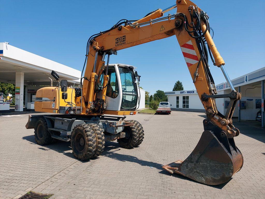Liebherr A 316 LITRONIC TL + 2005 DEUTZ 13400 STD. - Escavadeira de rodas: foto 3 Liebherr A 316 LITRONIC TL + 2005 DEUTZ 13400 STD. - Escavadeira de rodas: foto 3